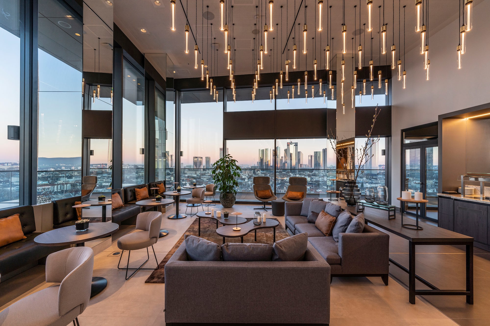 a room with a large window and a large city view