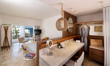 a room with a bed and a mirror