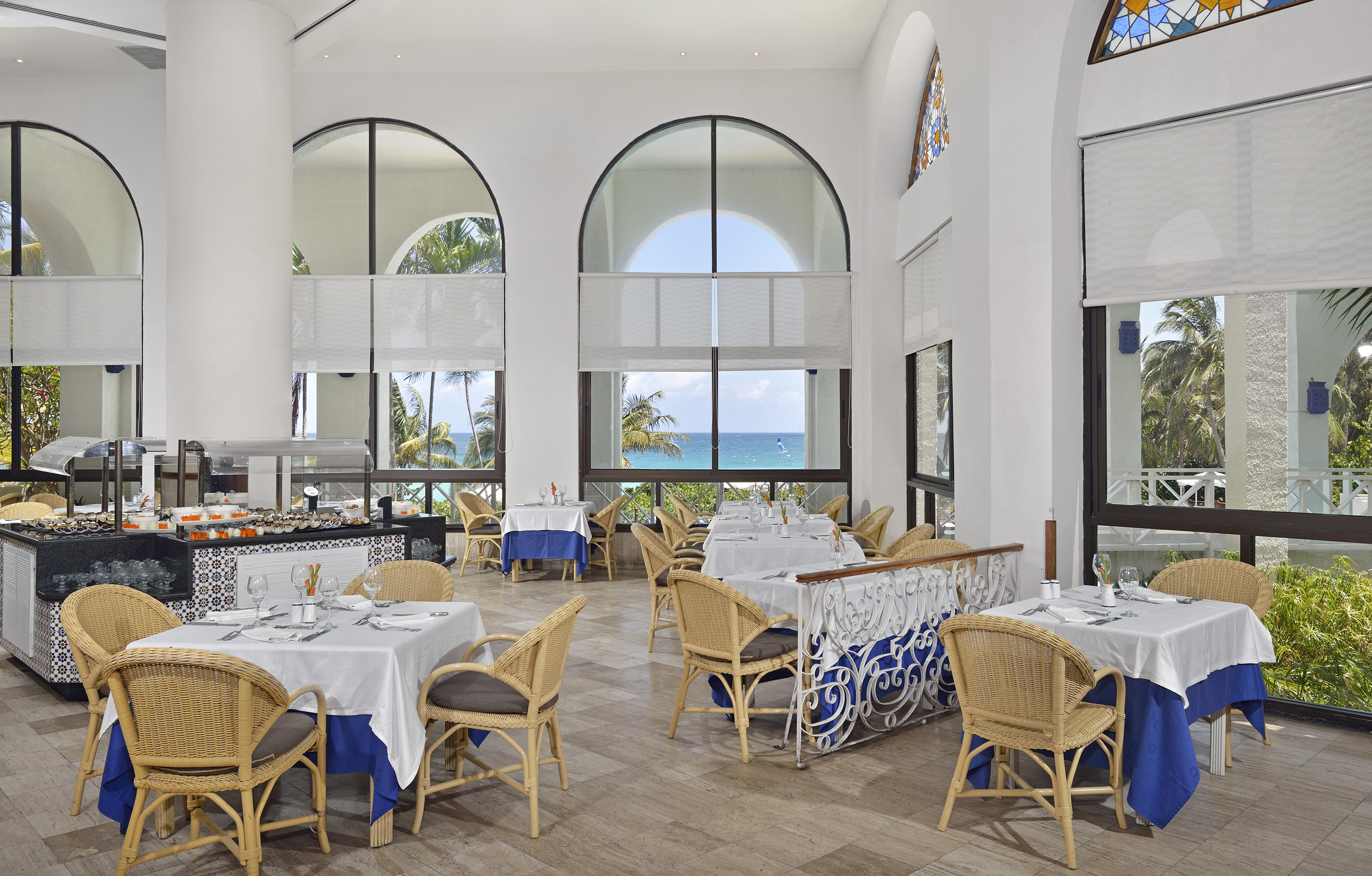 a restaurant with tables and chairs