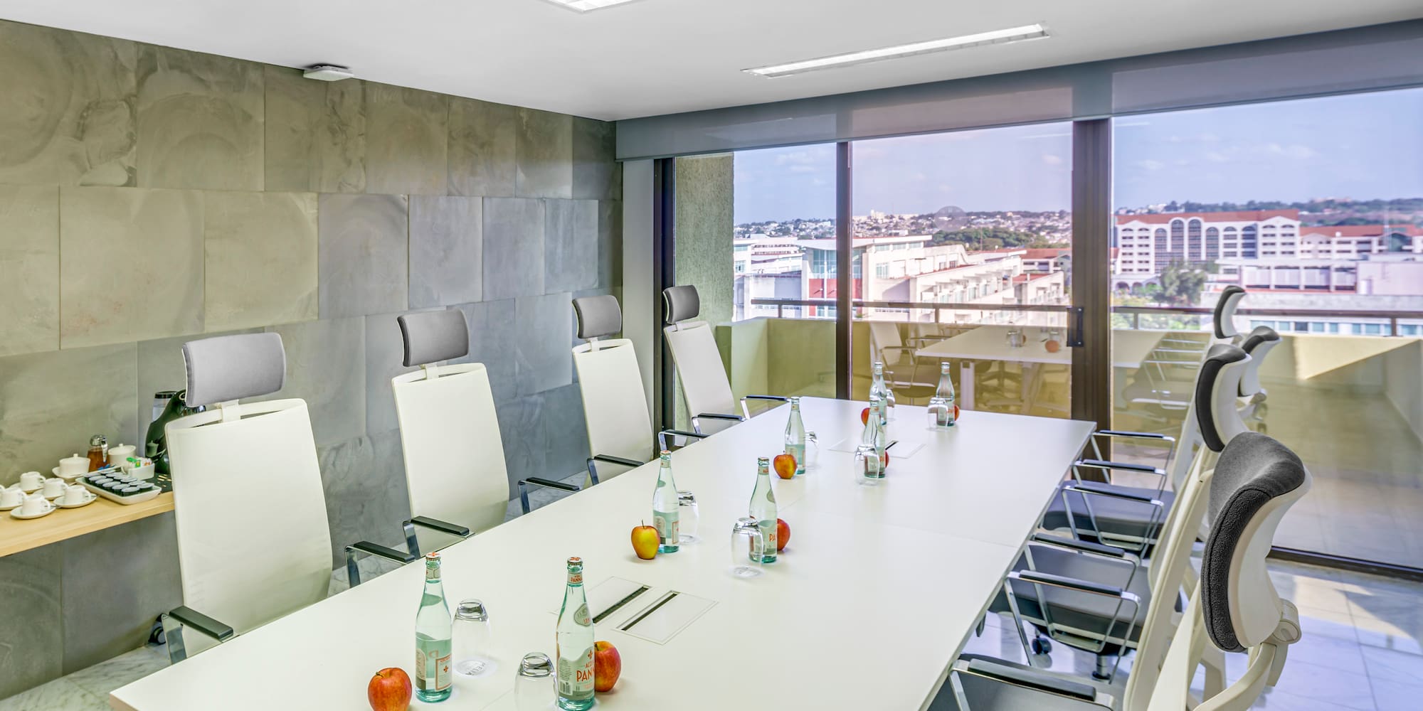 a conference room with a table and chairs