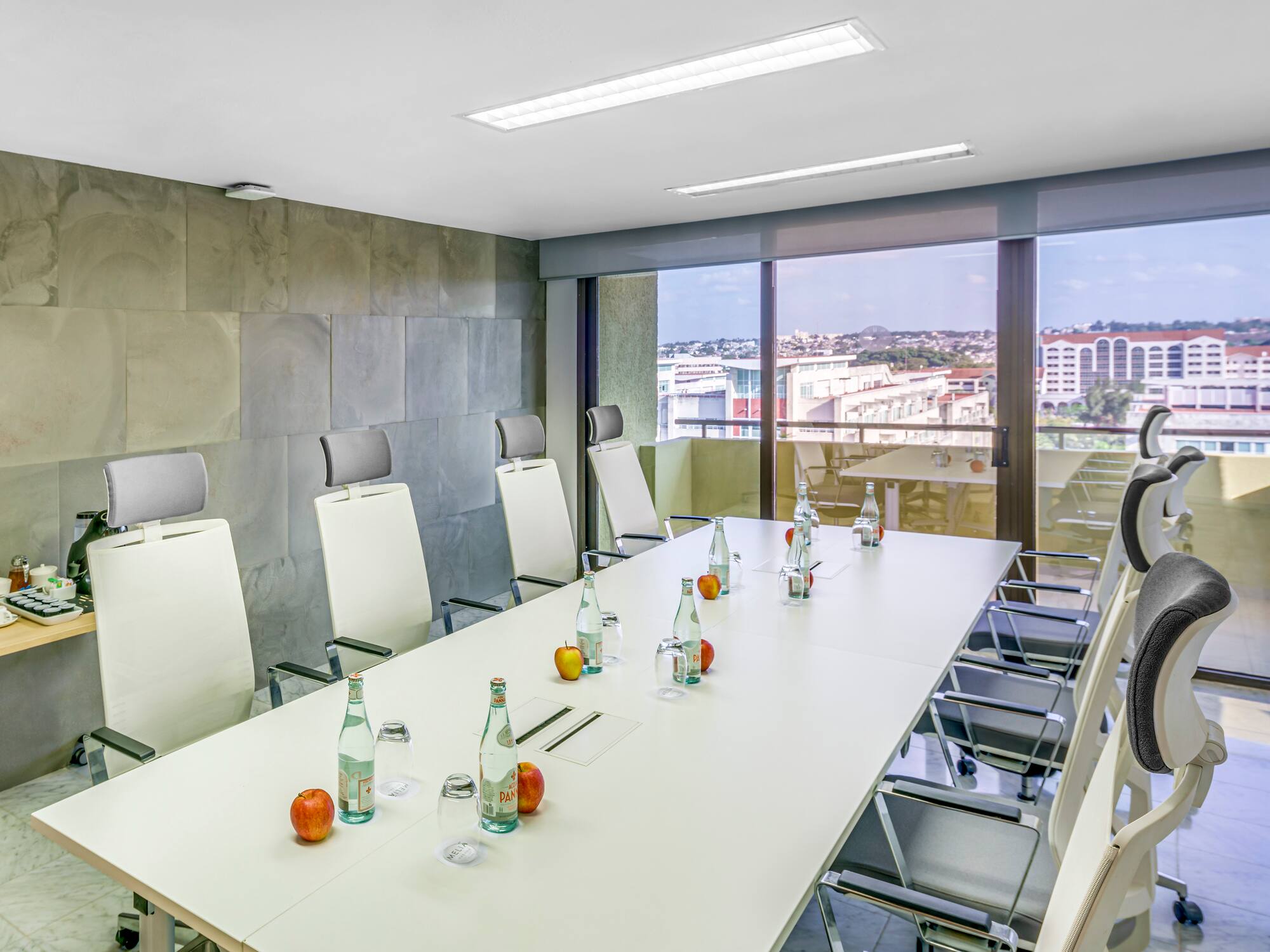 a conference room with a table and chairs