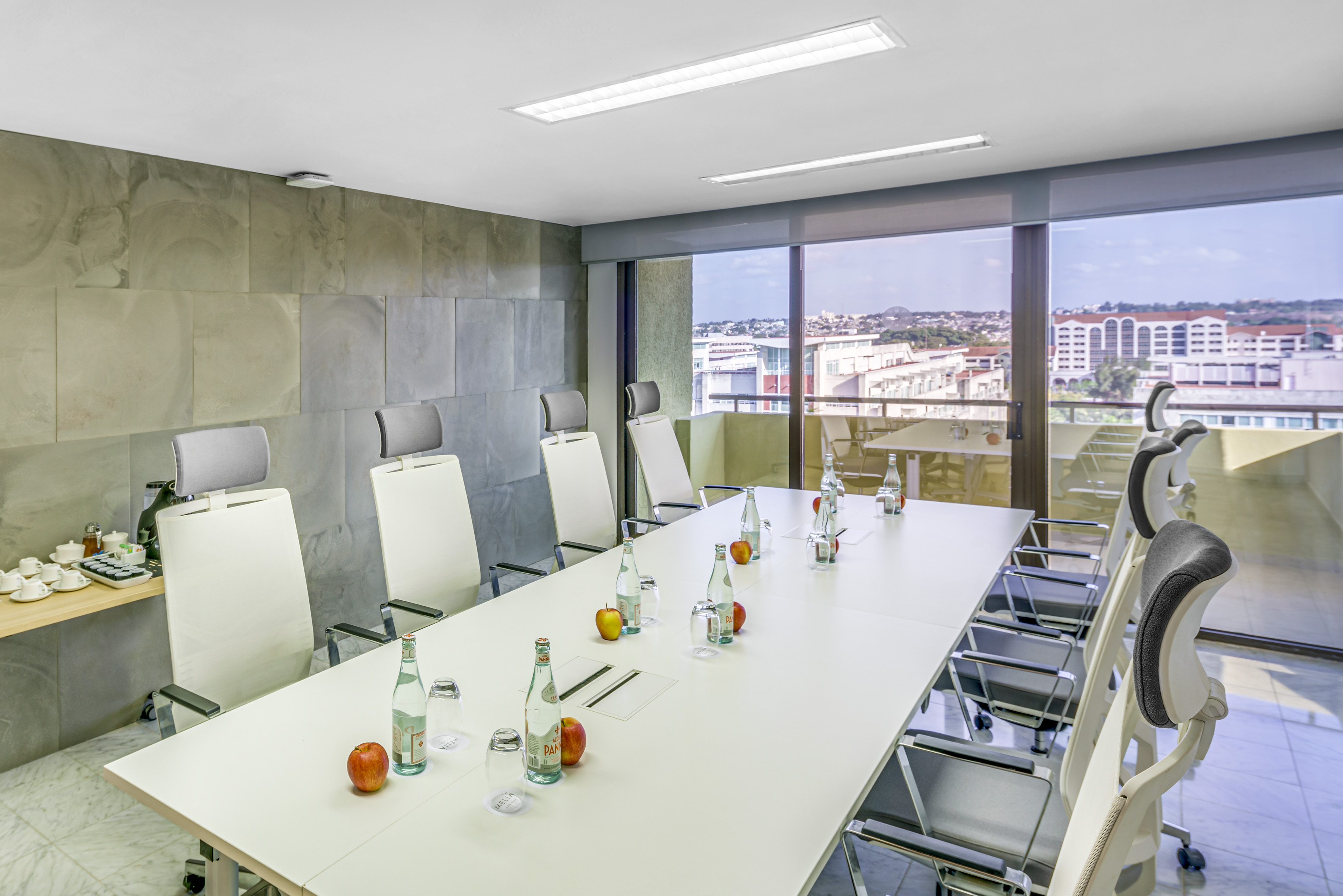 a conference room with a table and chairs