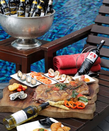 a table with food and wine bottles