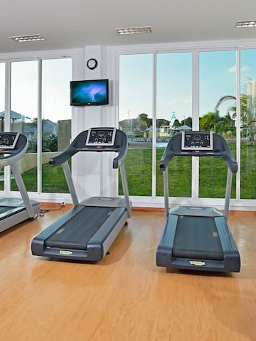 a group of treadmills in a gym