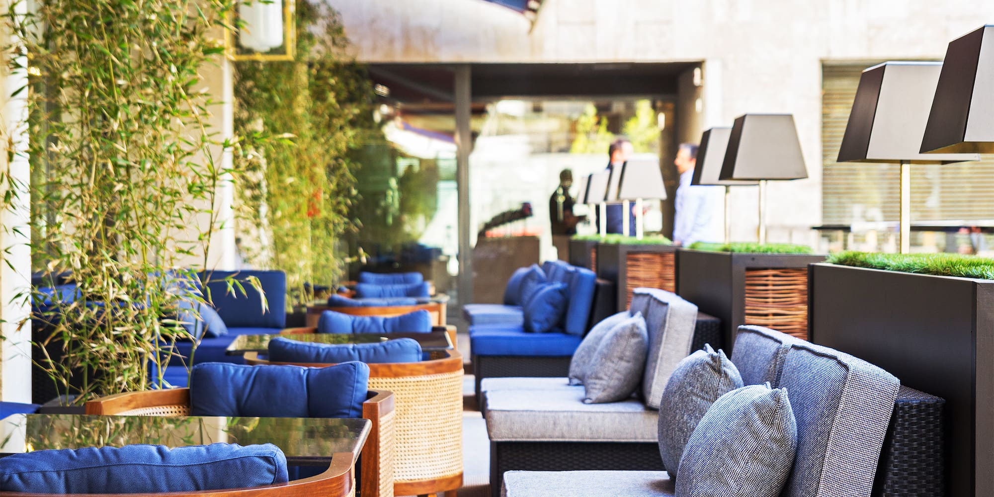 a patio with chairs and tables