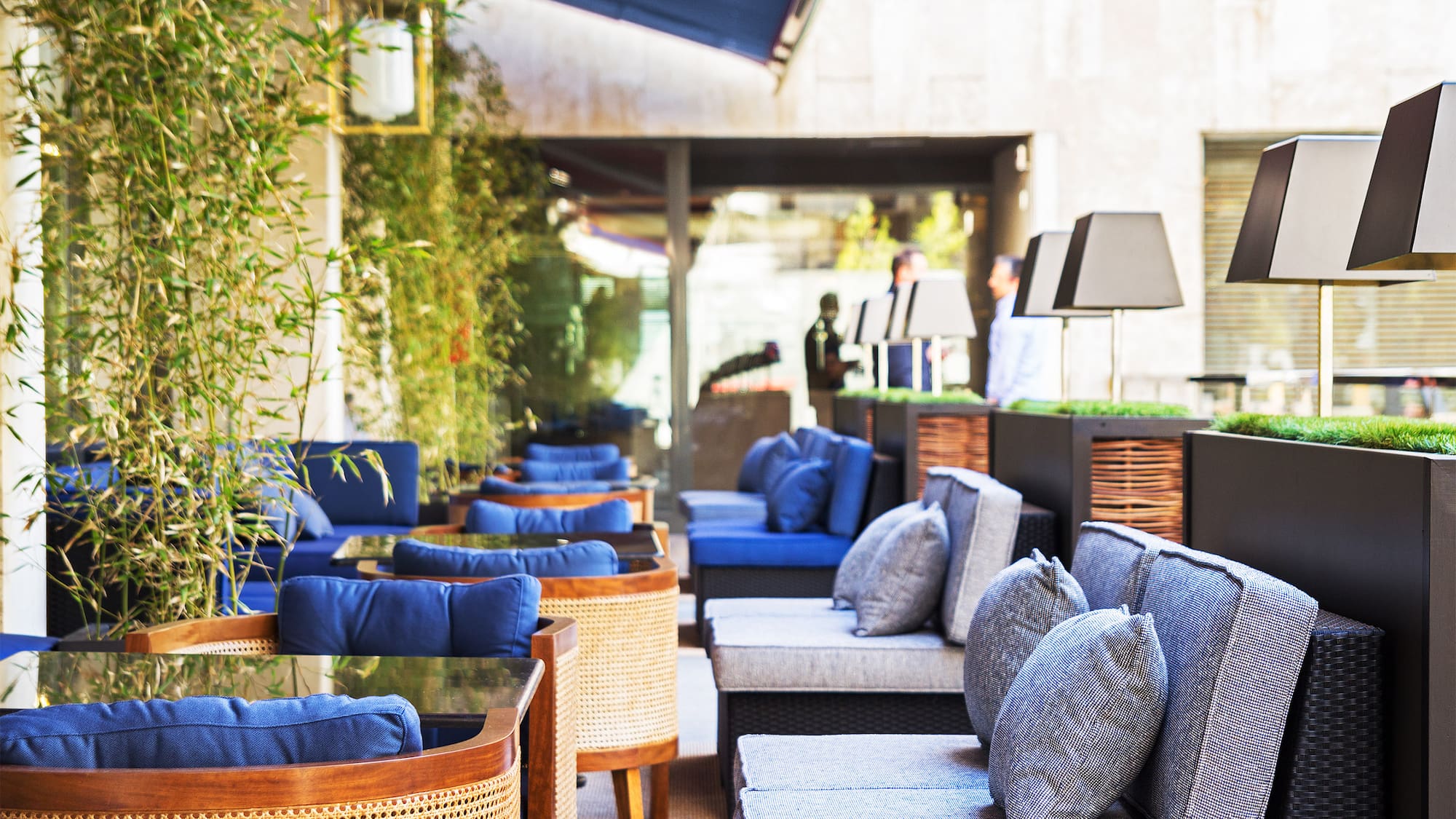 a patio with chairs and tables