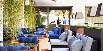 a patio with chairs and tables