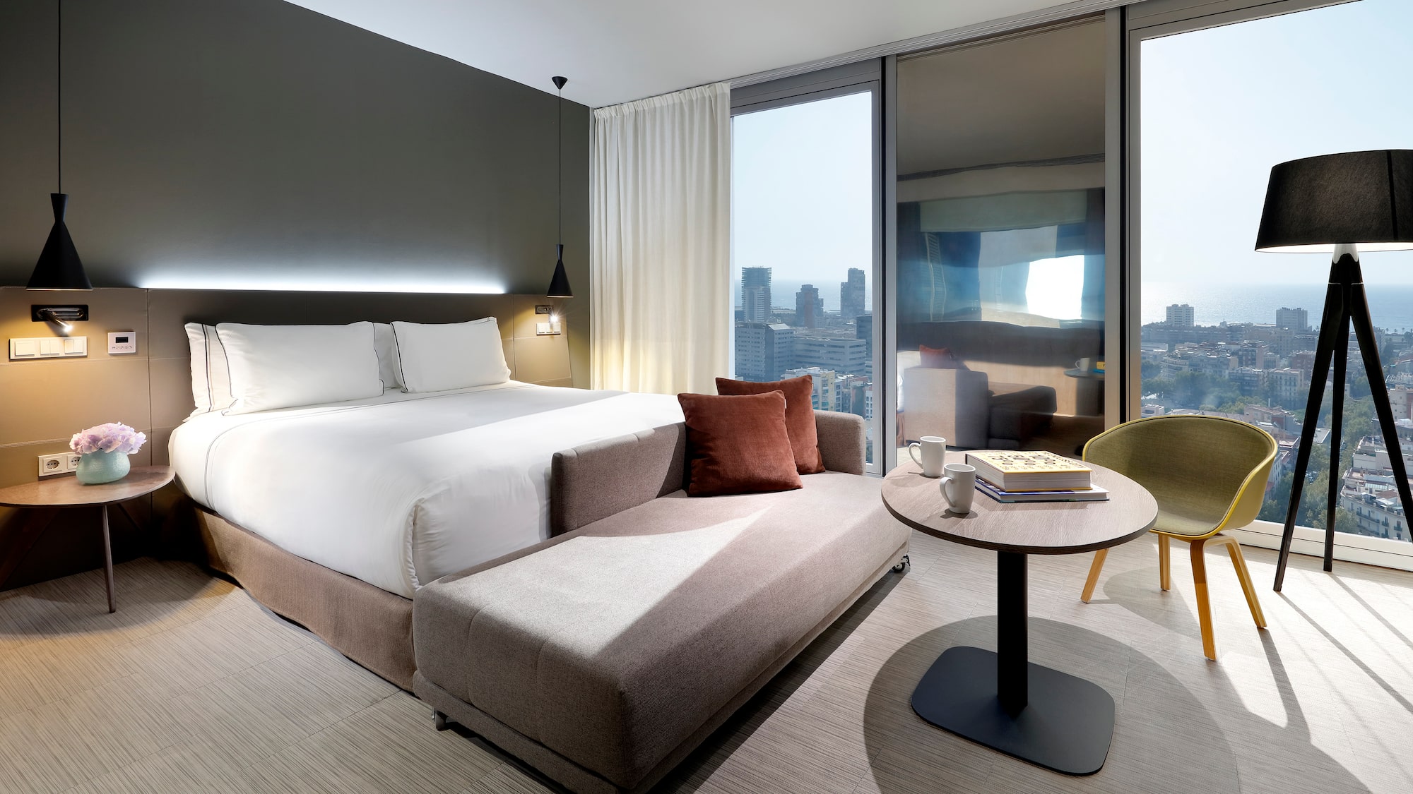 a bedroom with a bed and a table