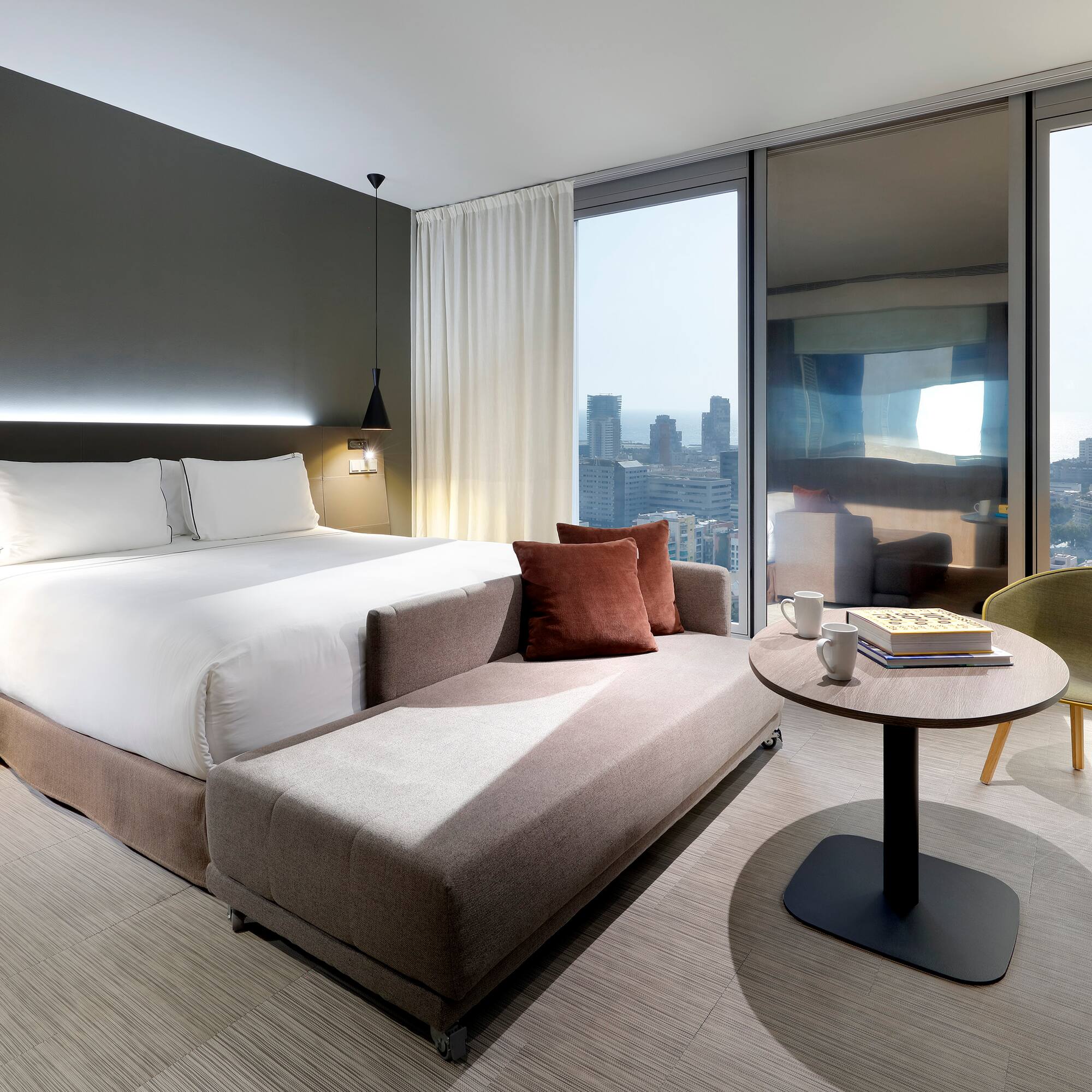 a bedroom with a bed and a table