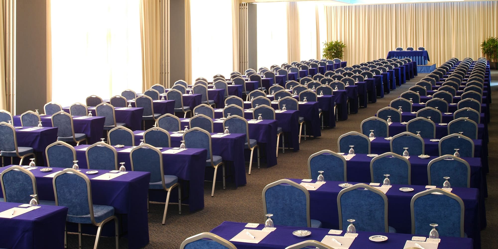 long room with tables and chairs