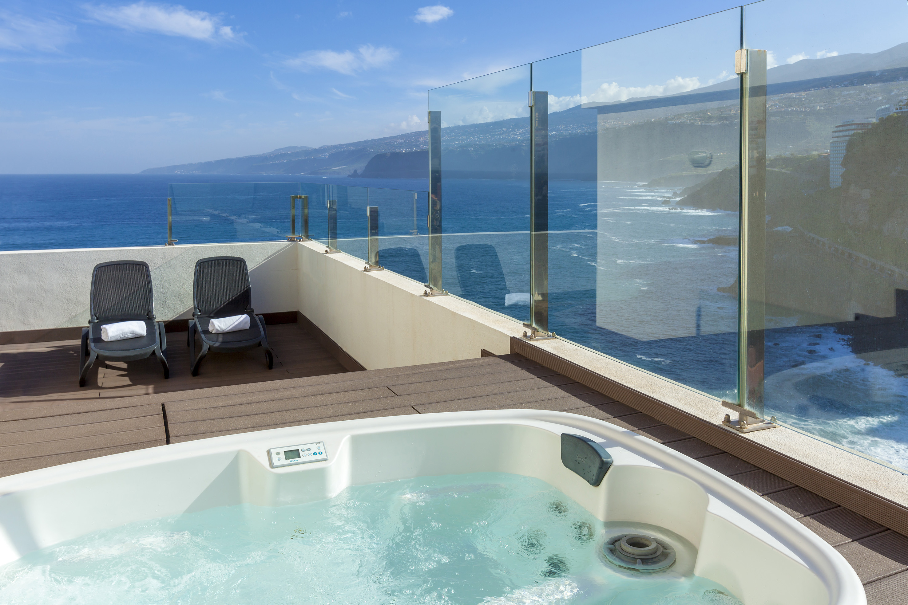 a hot tub overlooking the ocean