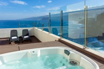 a hot tub overlooking the ocean