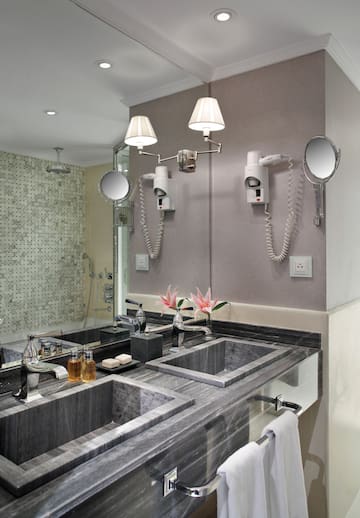 a bathroom with a mirror and sink