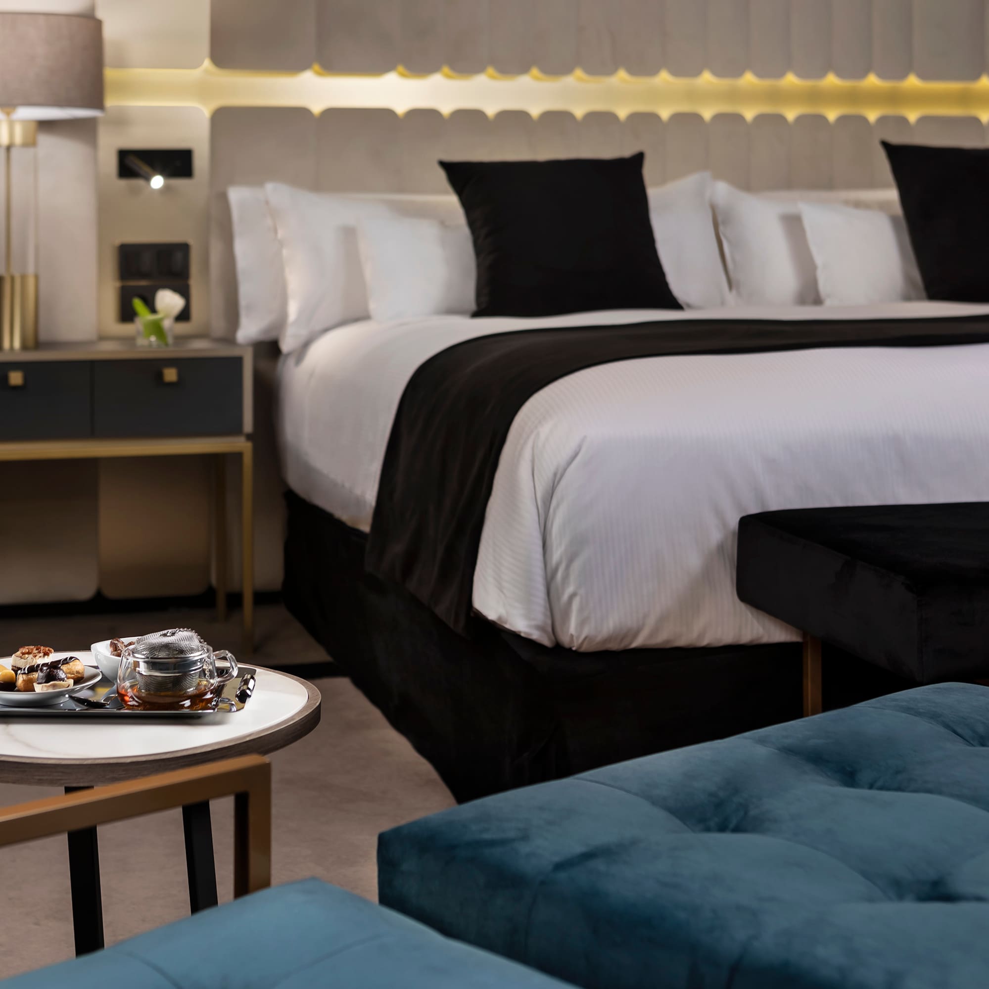 a bed with a tray of food