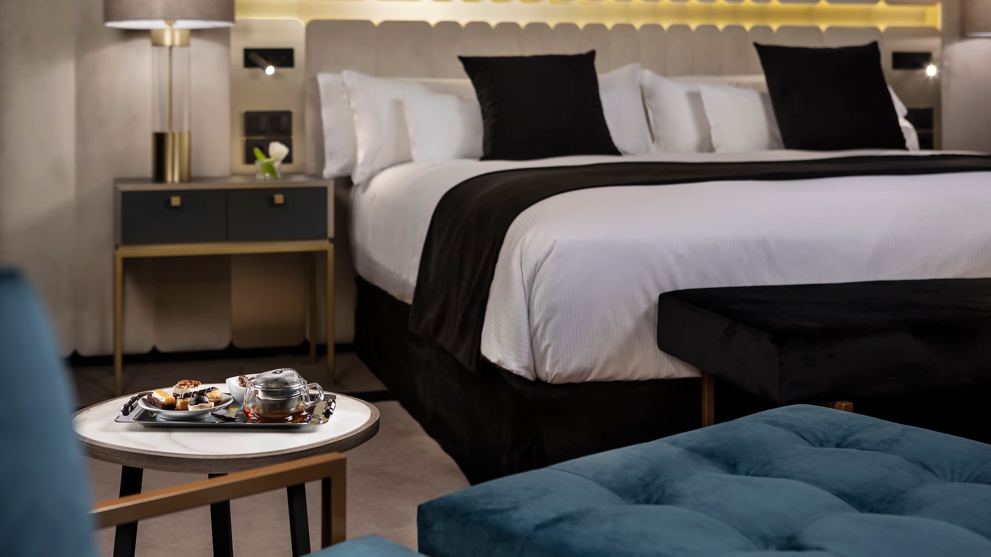 a bed with a tray of food