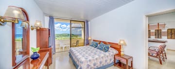 a bedroom with a bed and a balcony