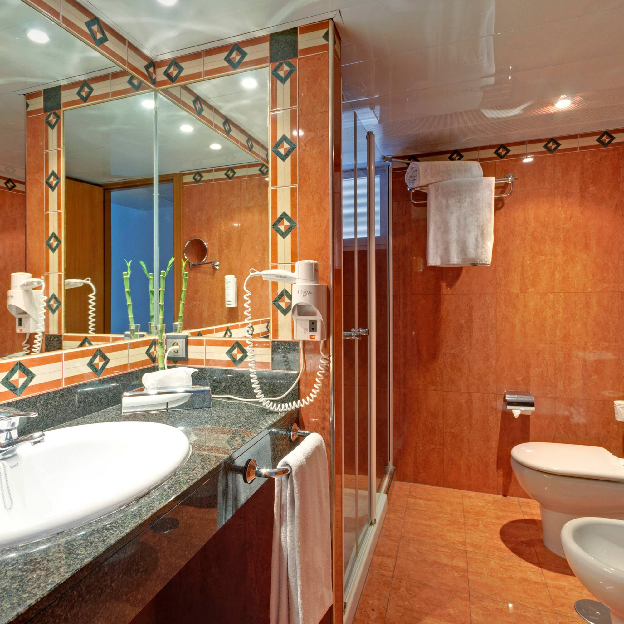 a bathroom with a mirror and sink
