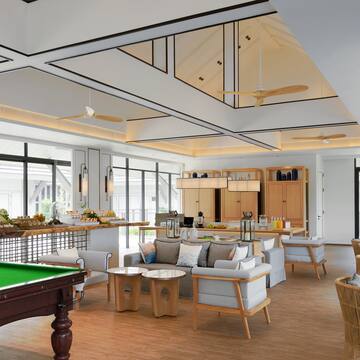 a room with a pool table and a pool table