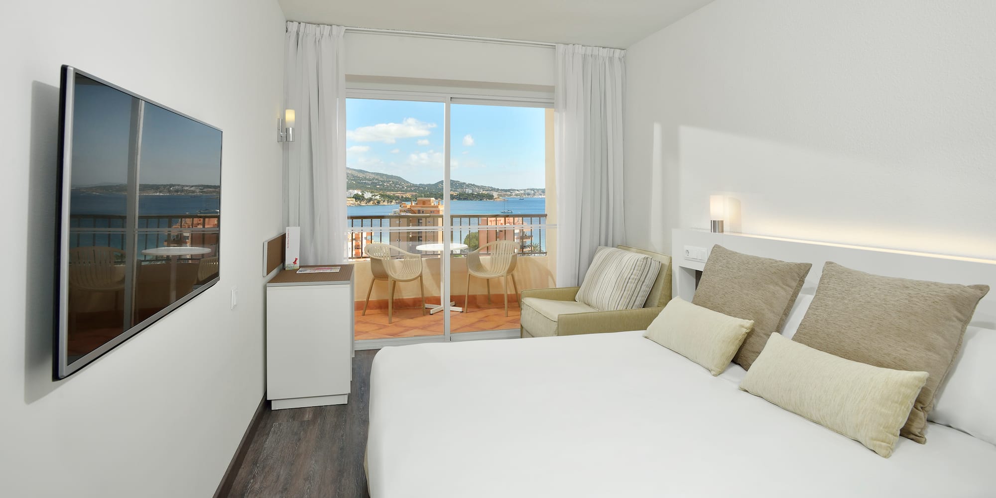 a room with a bed and a glass door