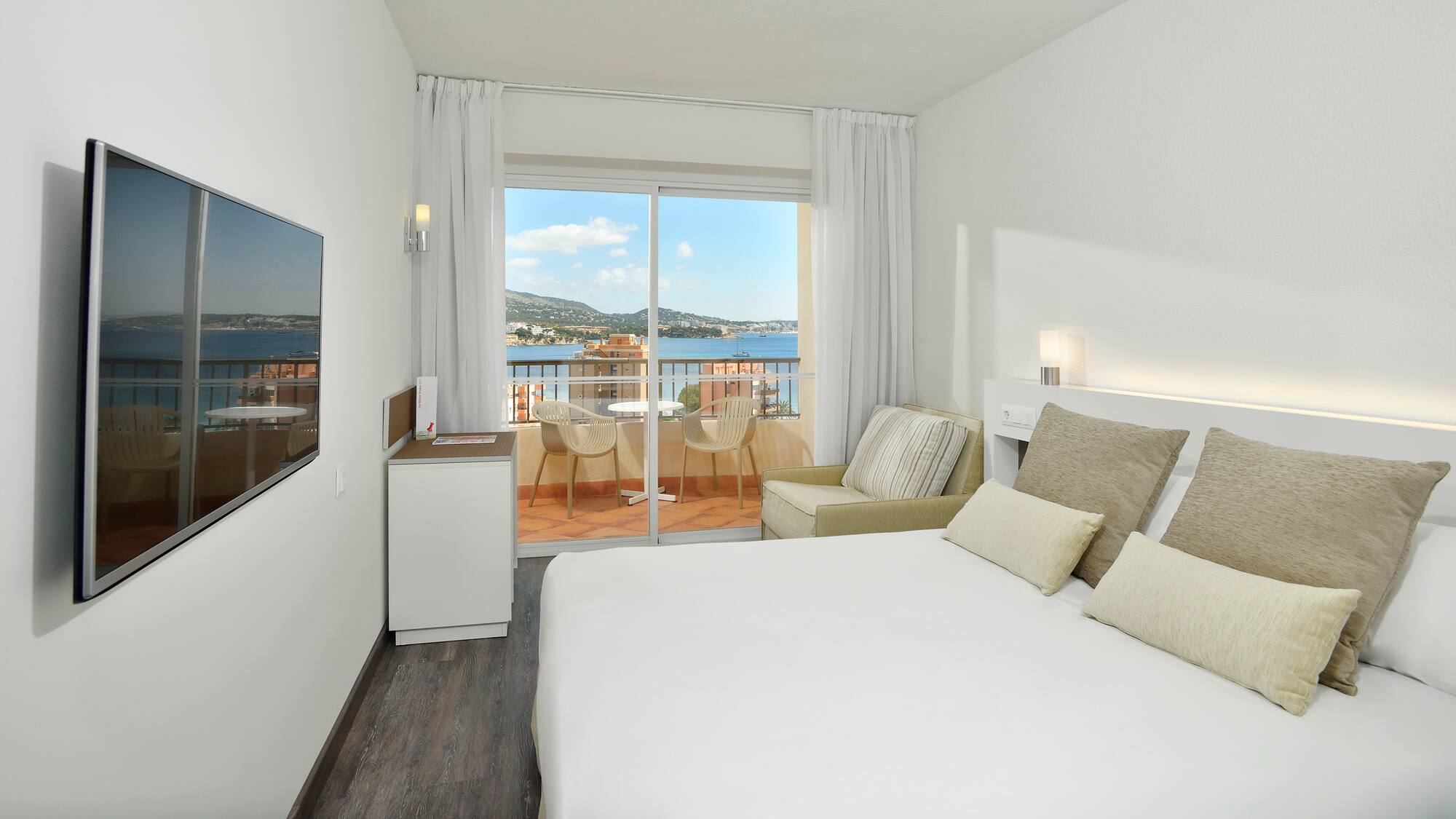 a room with a bed and a glass door