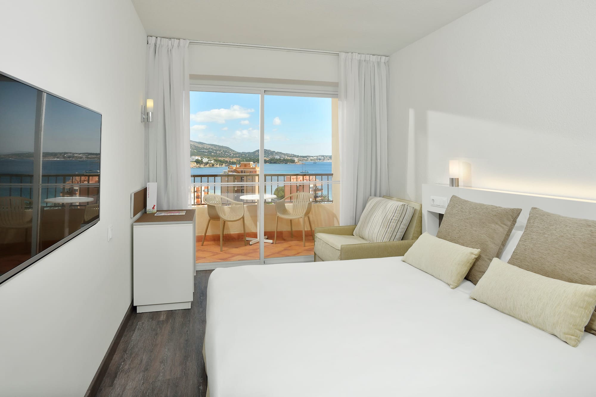 a room with a bed and a glass door