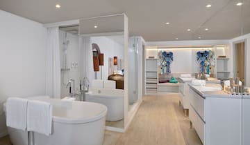 a bathroom with a tub and a shower