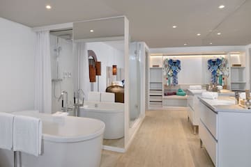 a bathroom with a tub and a shower