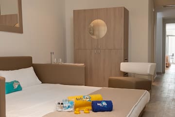 a bed with towels and yellow ducklings