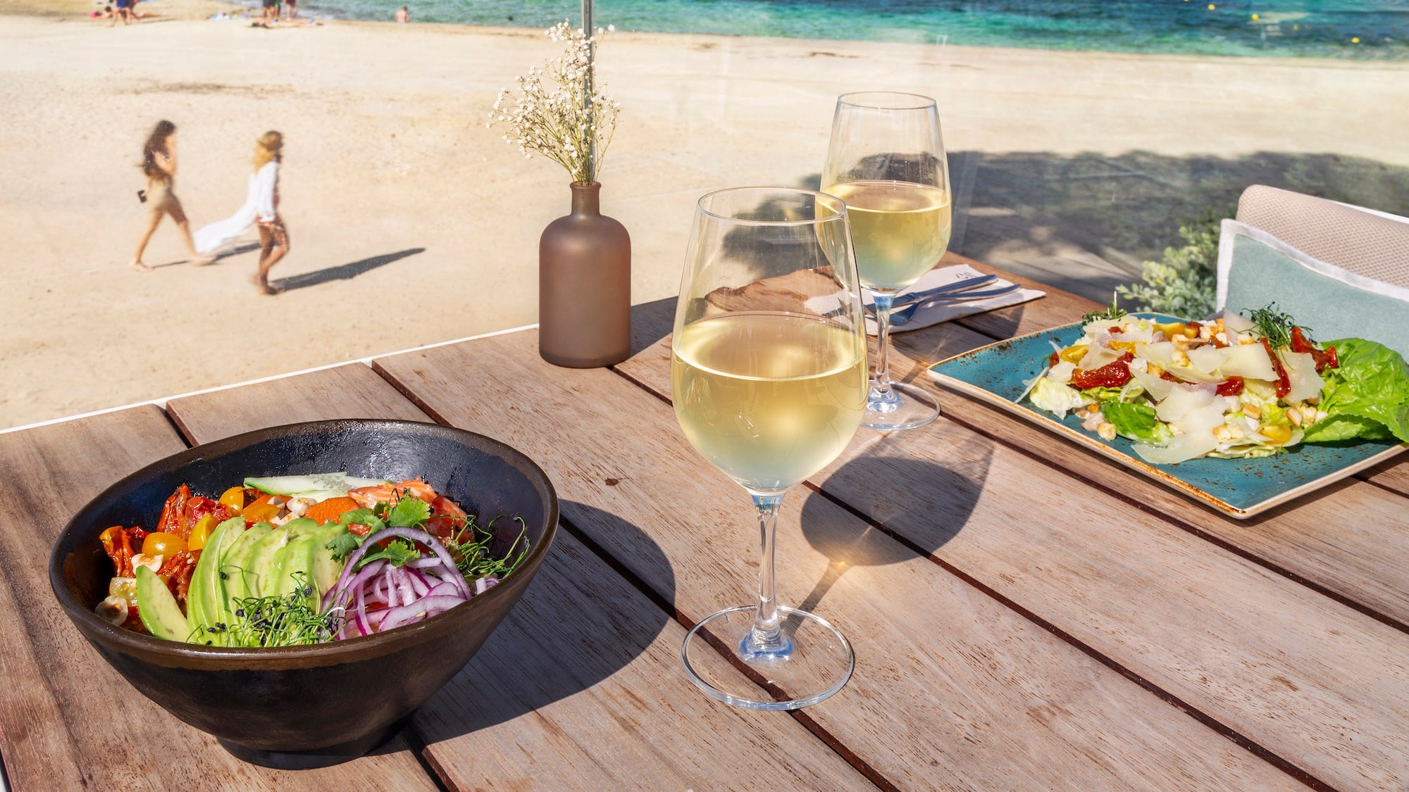 a table with food and wine glasses on it