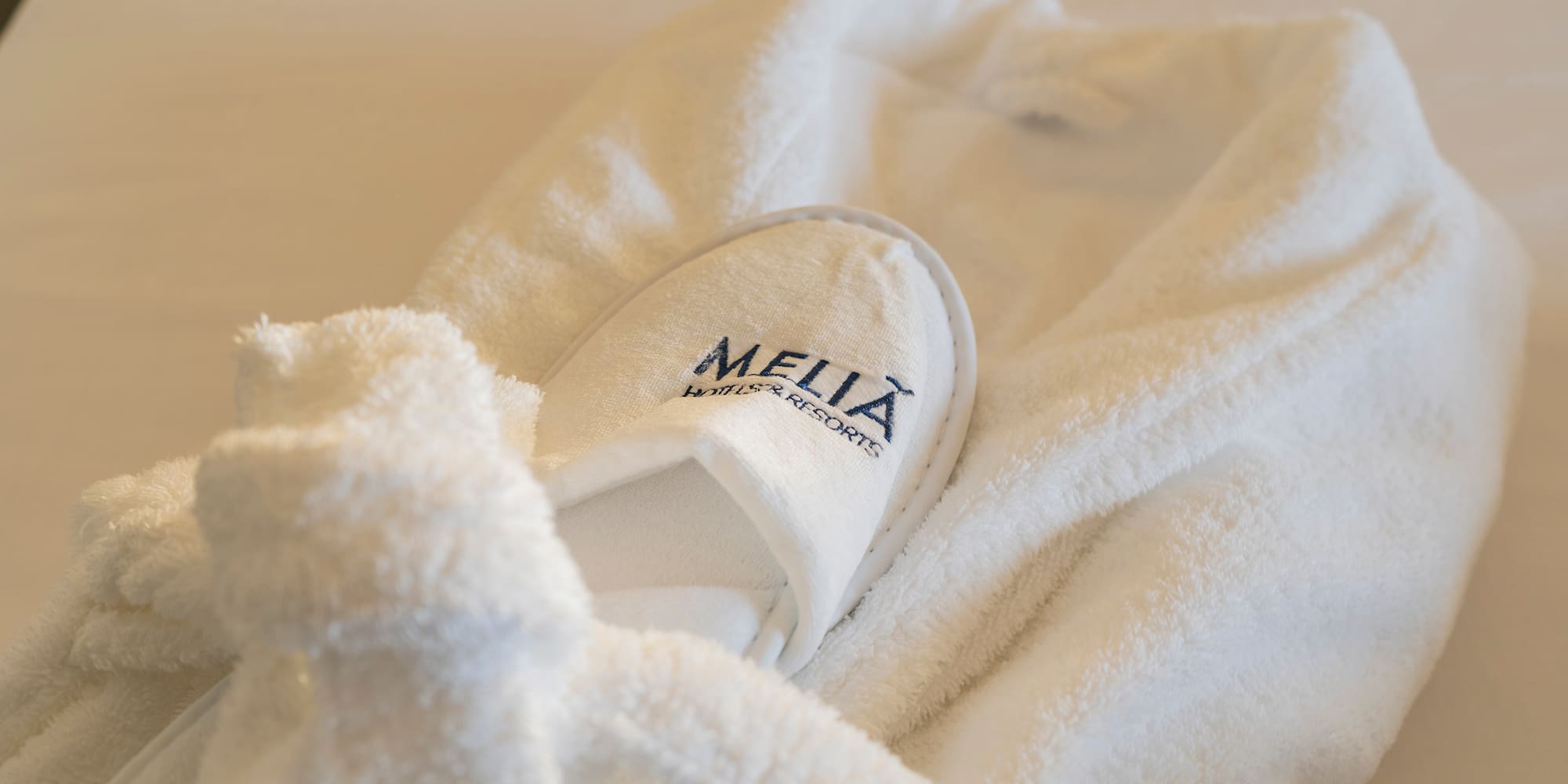 a white robe with slippers on it