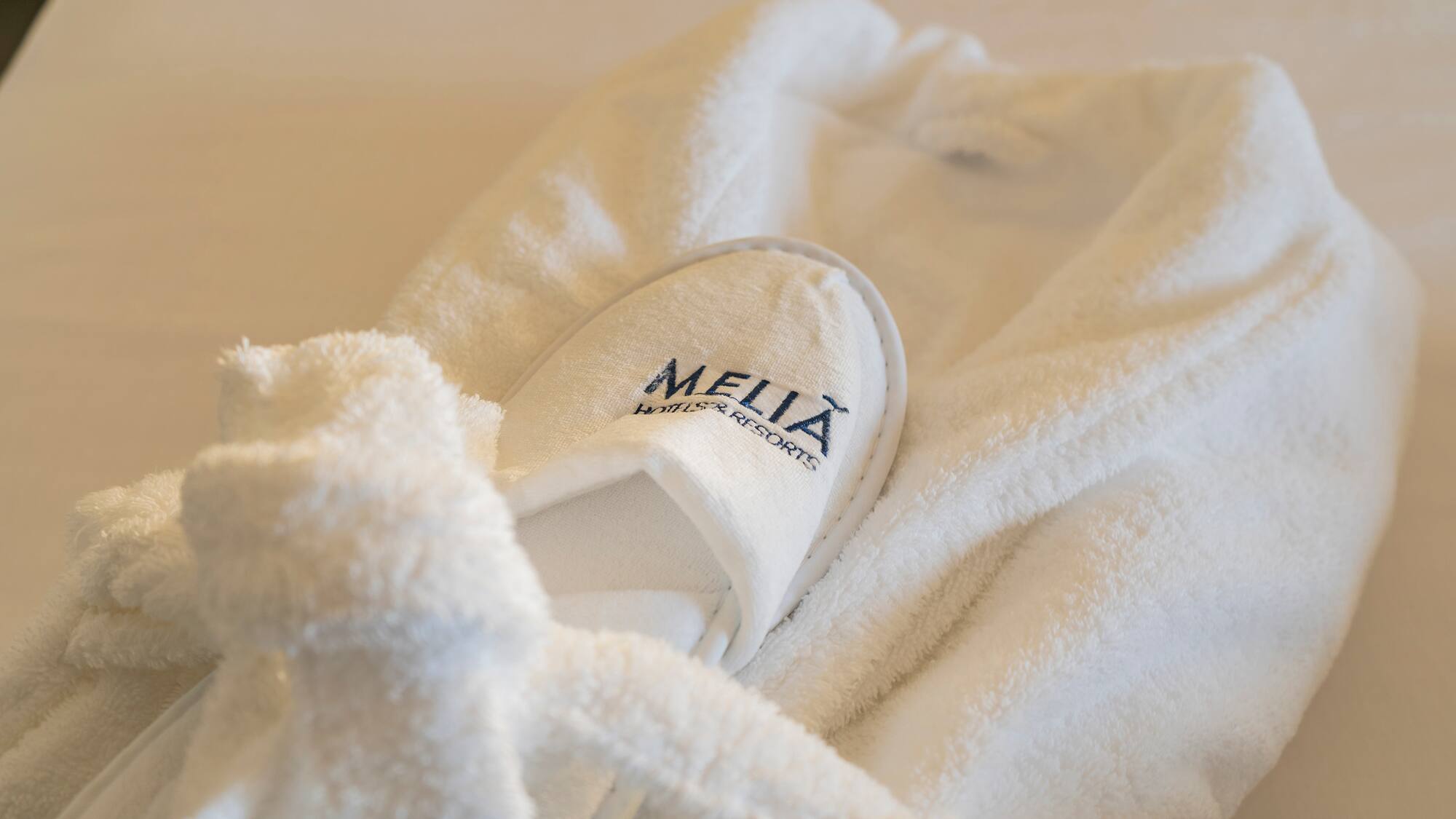 a white robe with slippers on it