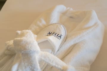 a white robe with slippers on it