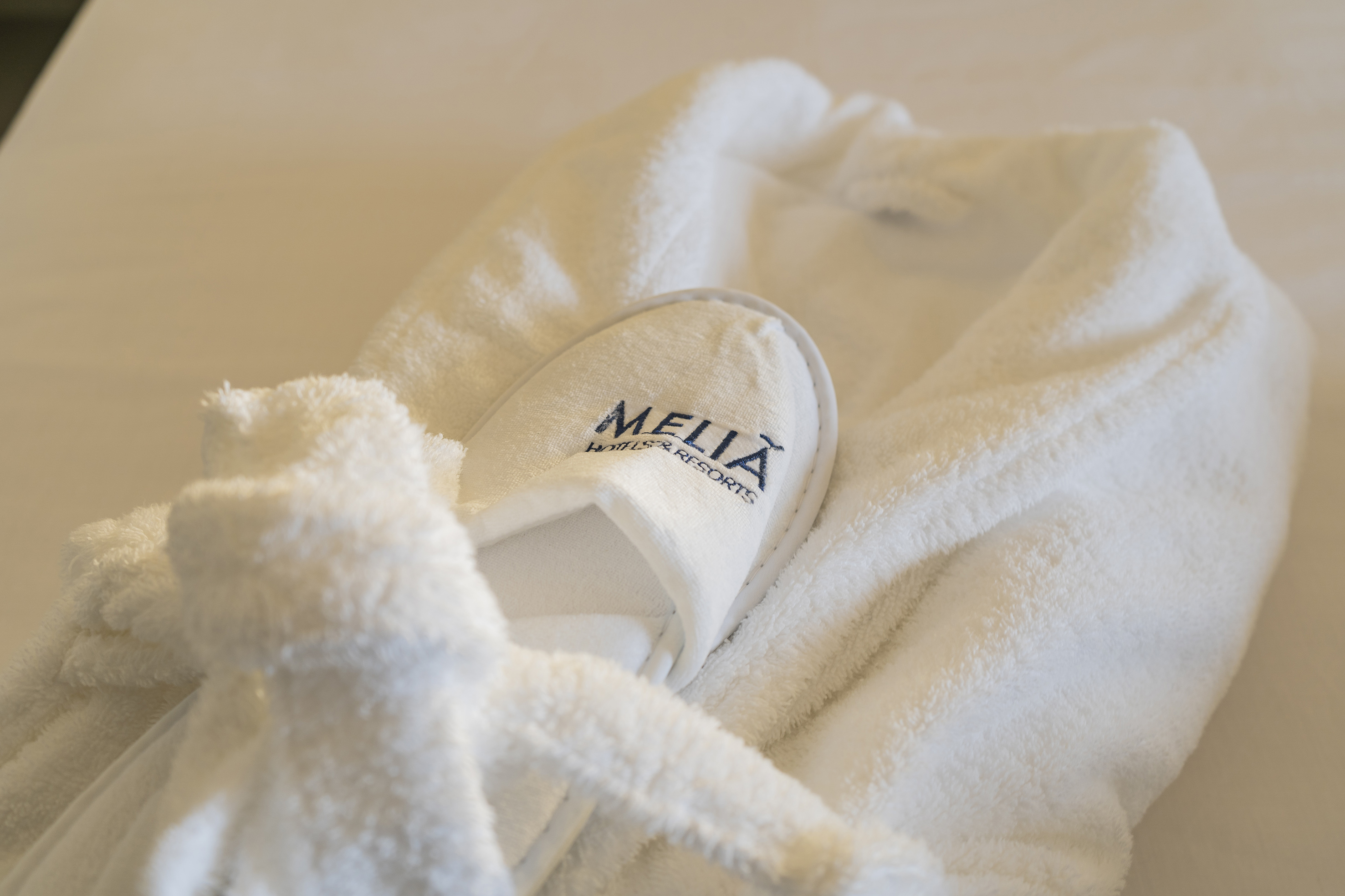 a white robe with slippers on it