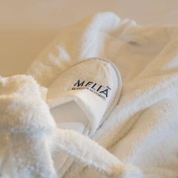 a white robe with slippers on it