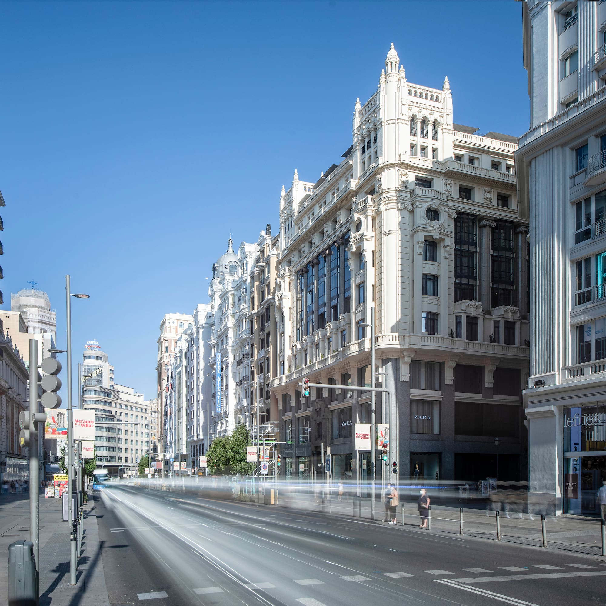 a street with buildings and cars on it