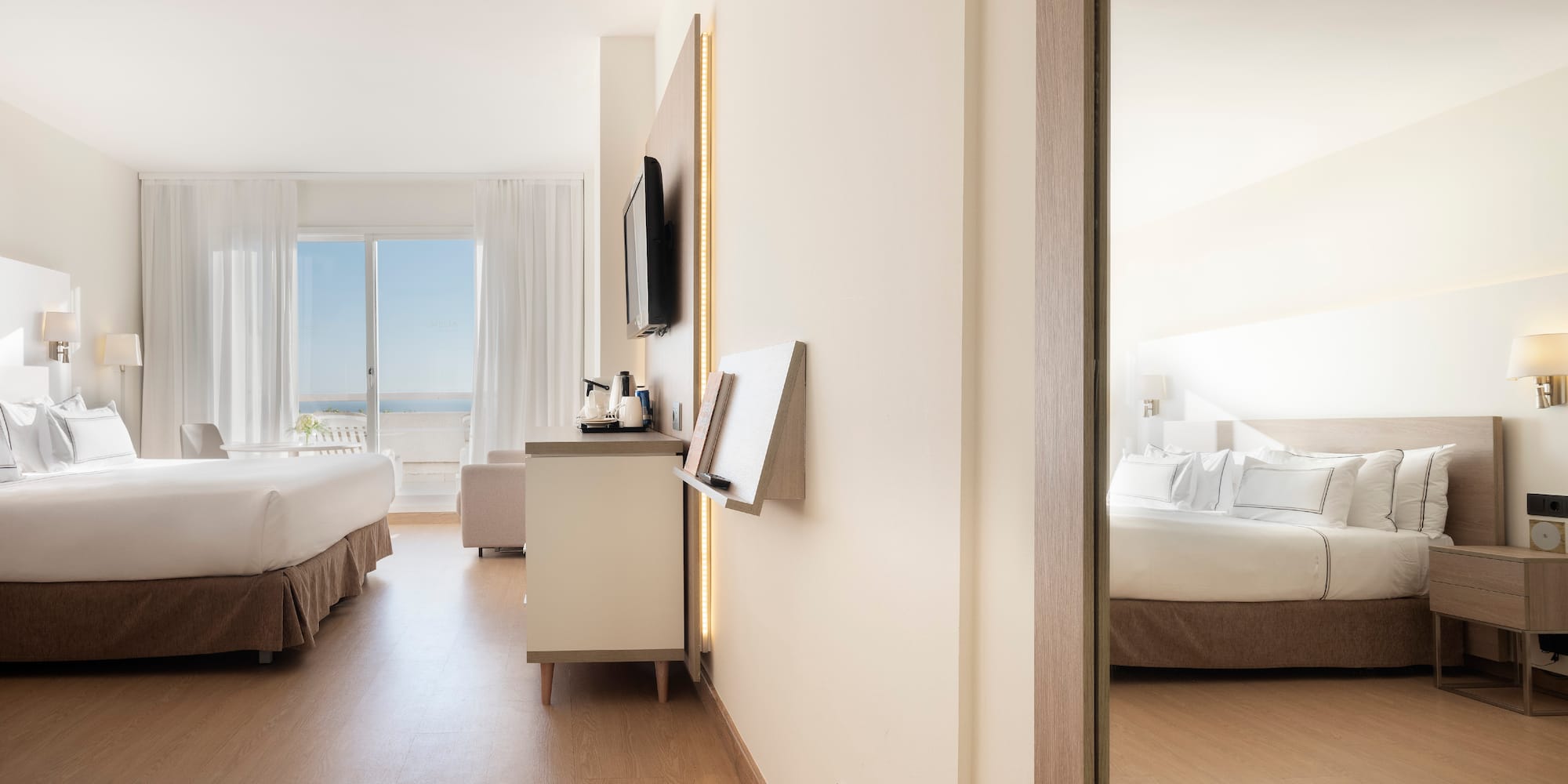 a room with a bed and a television