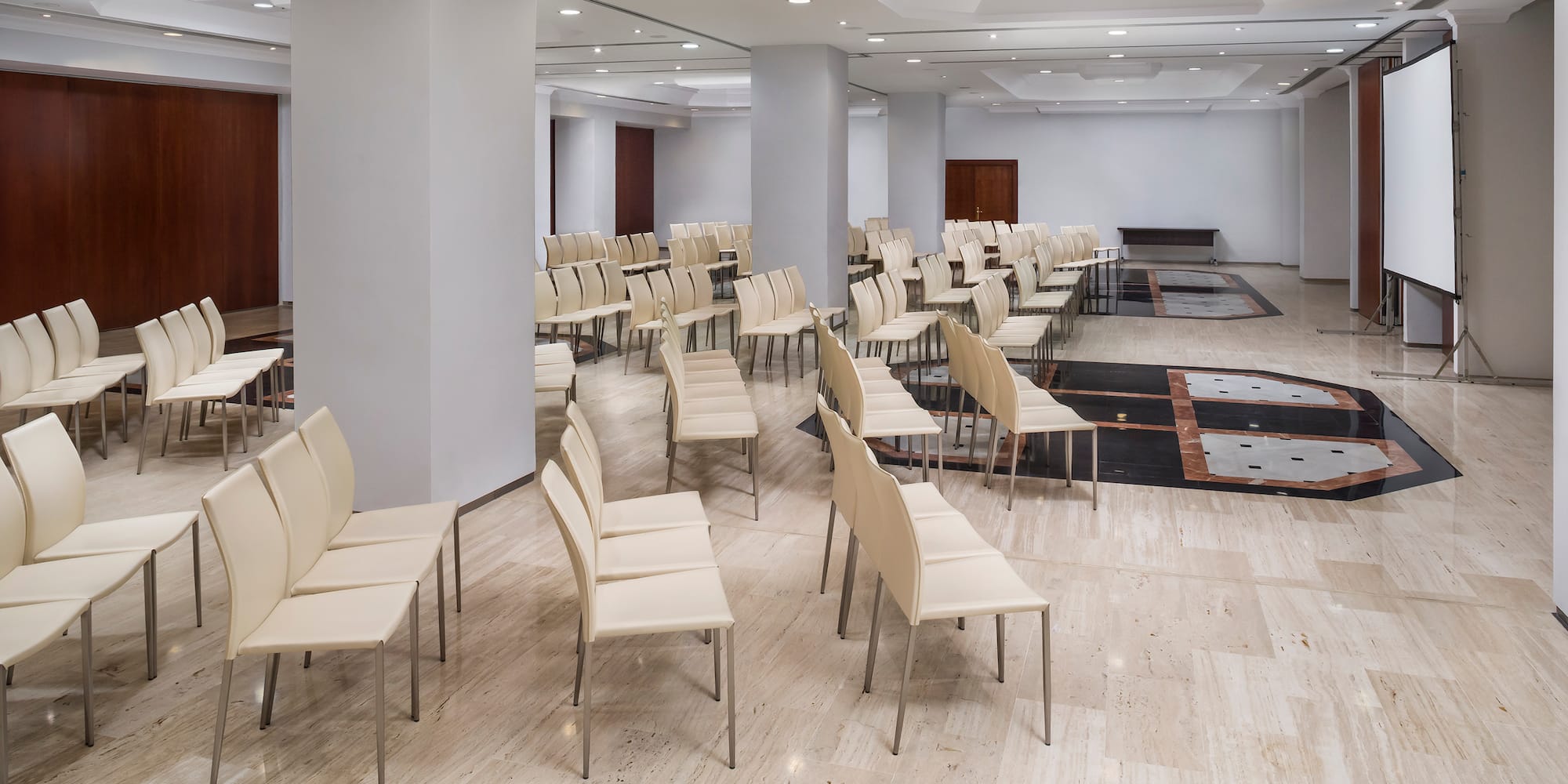 a room with white chairs