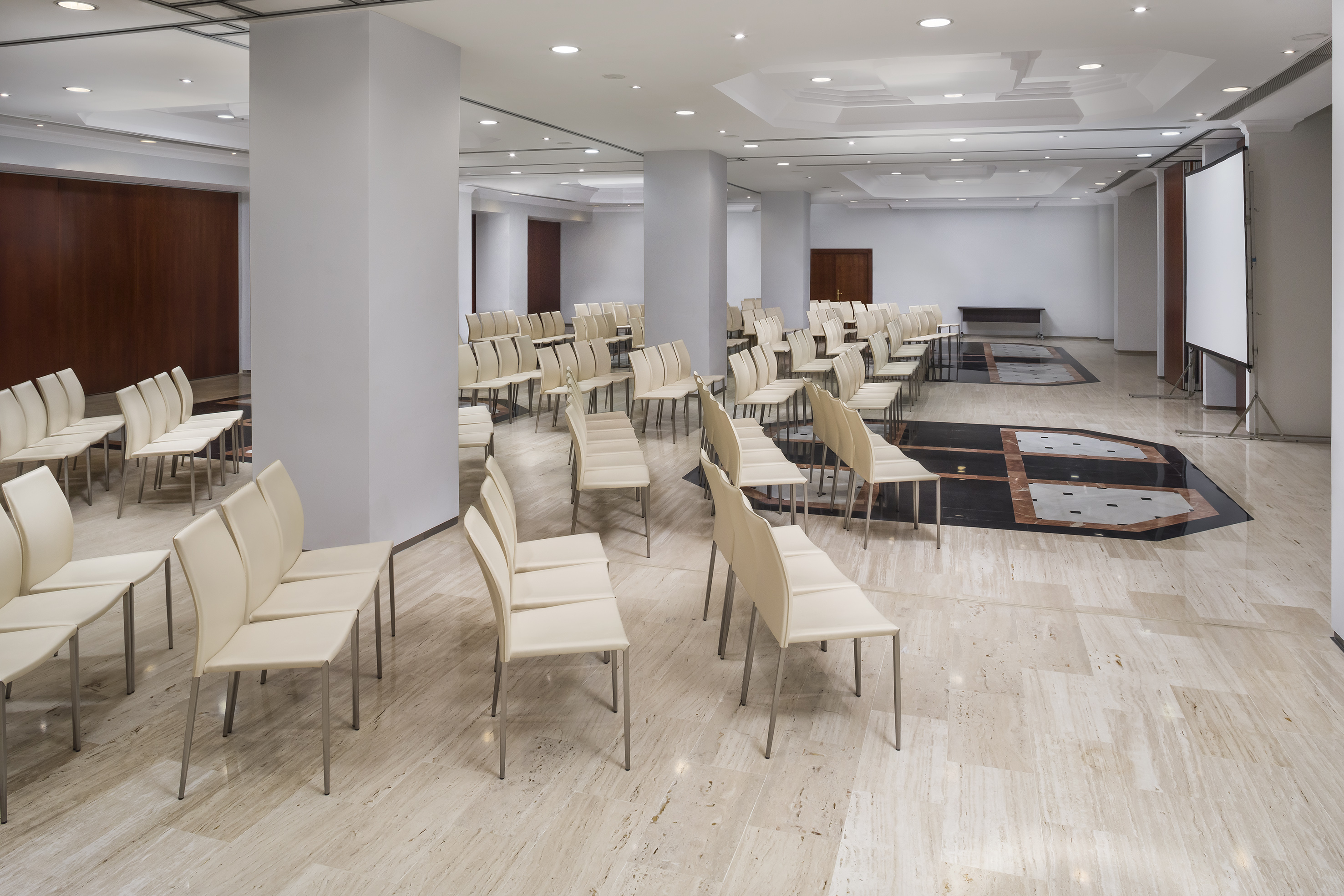 a room with white chairs