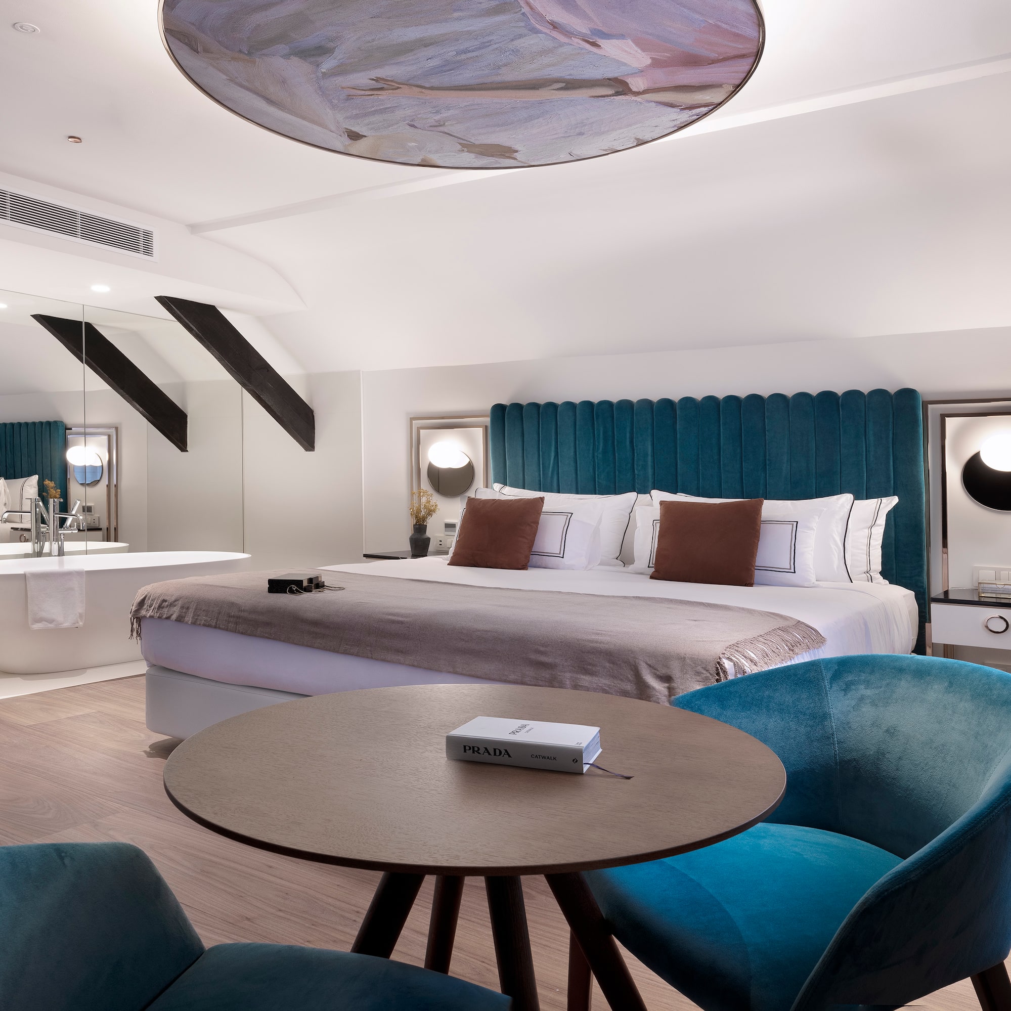 a room with a bed and a tub