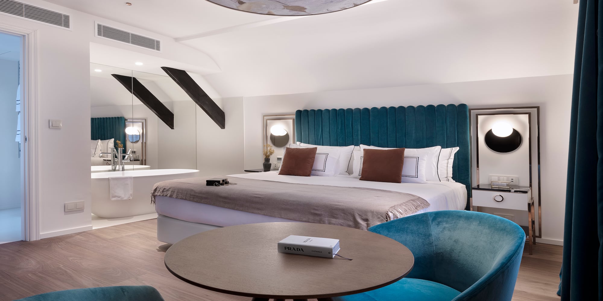 a room with a bed and a tub