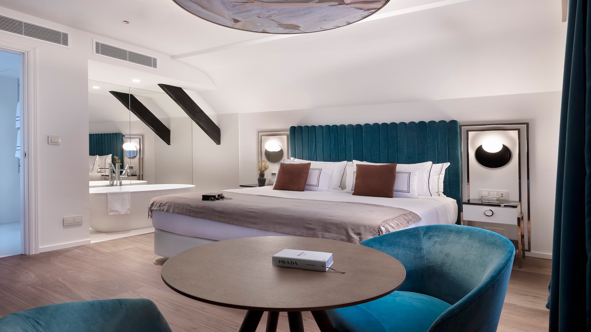 a room with a bed and a tub