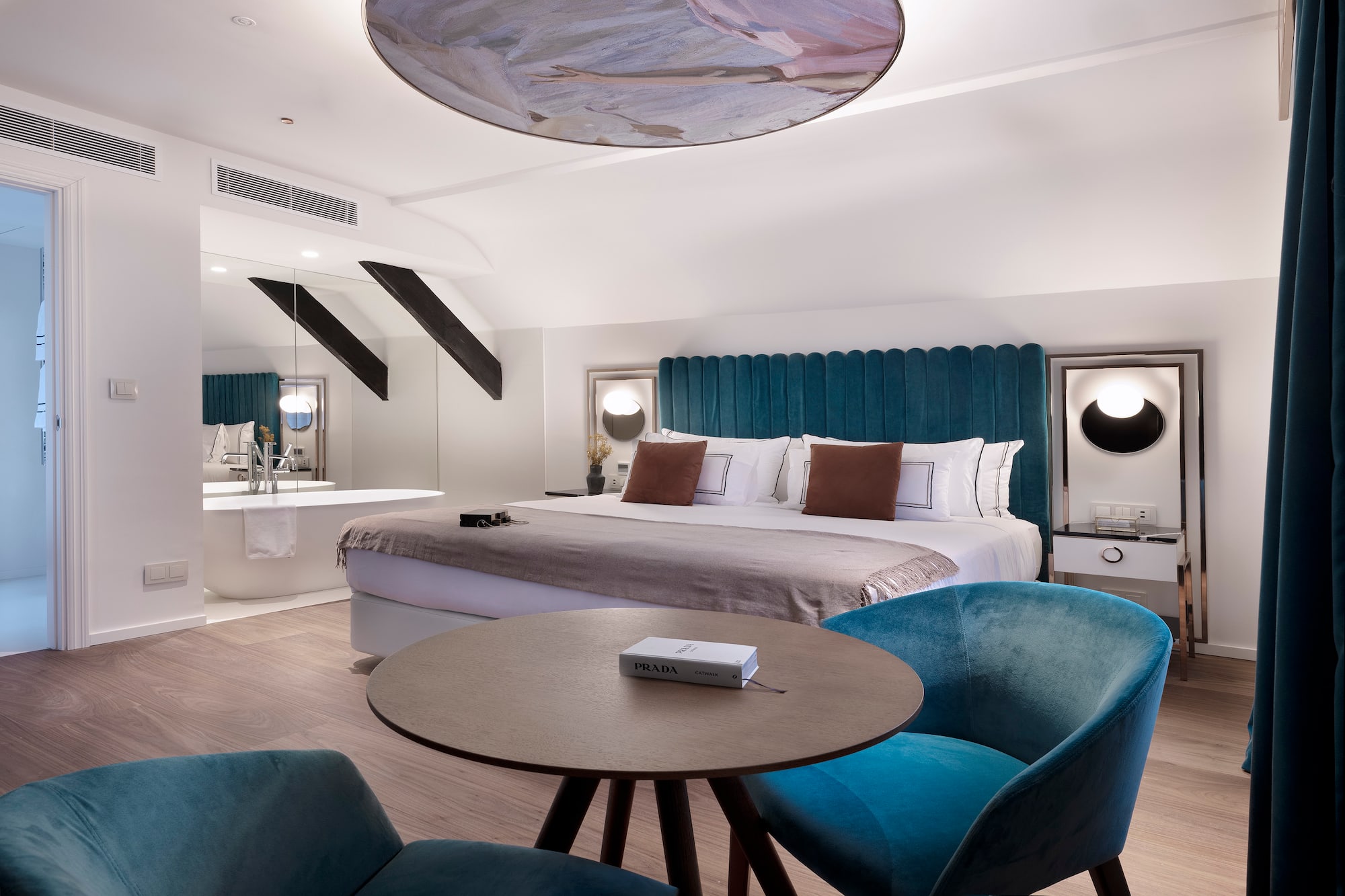 a room with a bed and a tub