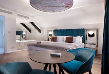 a room with a bed and a tub
