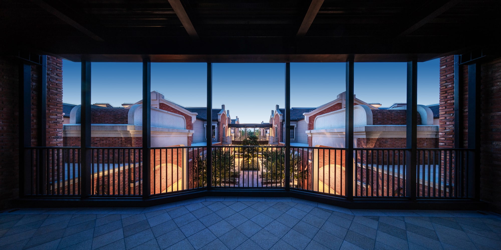 a balcony with a railing and a view of a city
