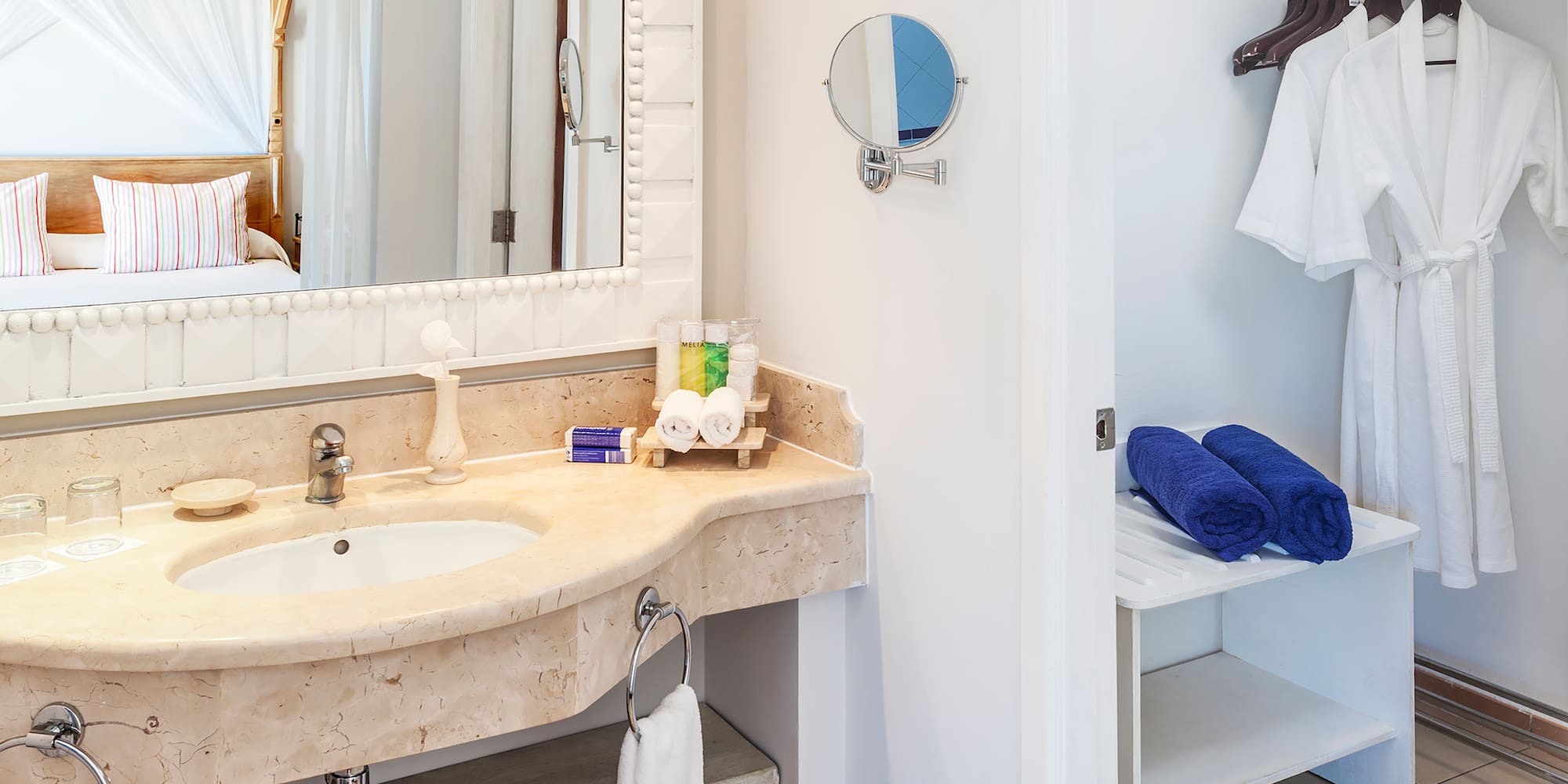 a bathroom with a mirror and a sink