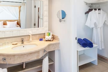 a bathroom with a mirror and a sink