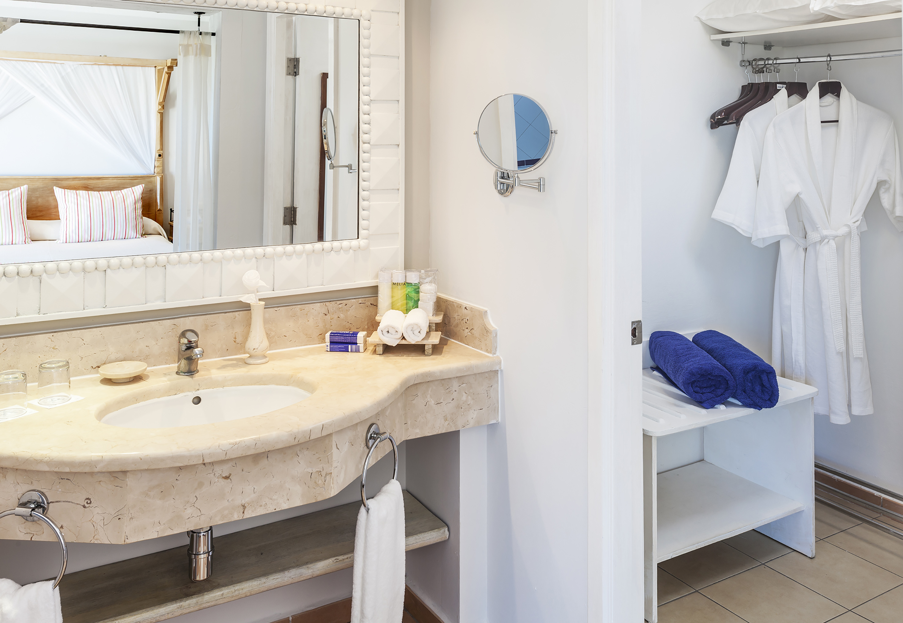 a bathroom with a mirror and a sink