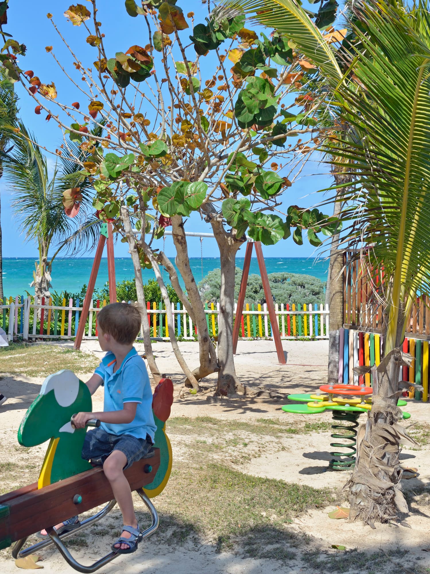 a child on a seesaw in a park