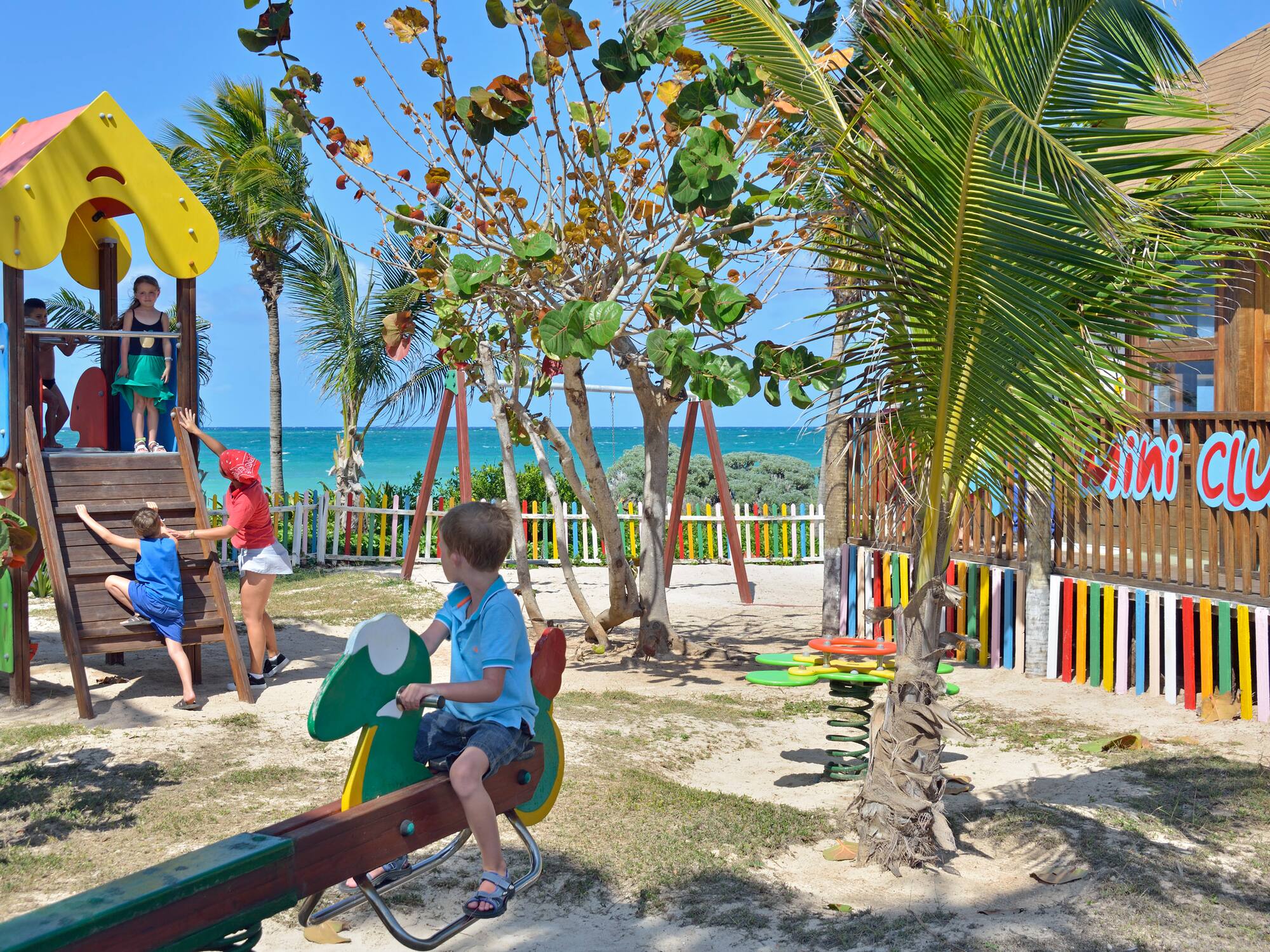 a child on a seesaw in a park