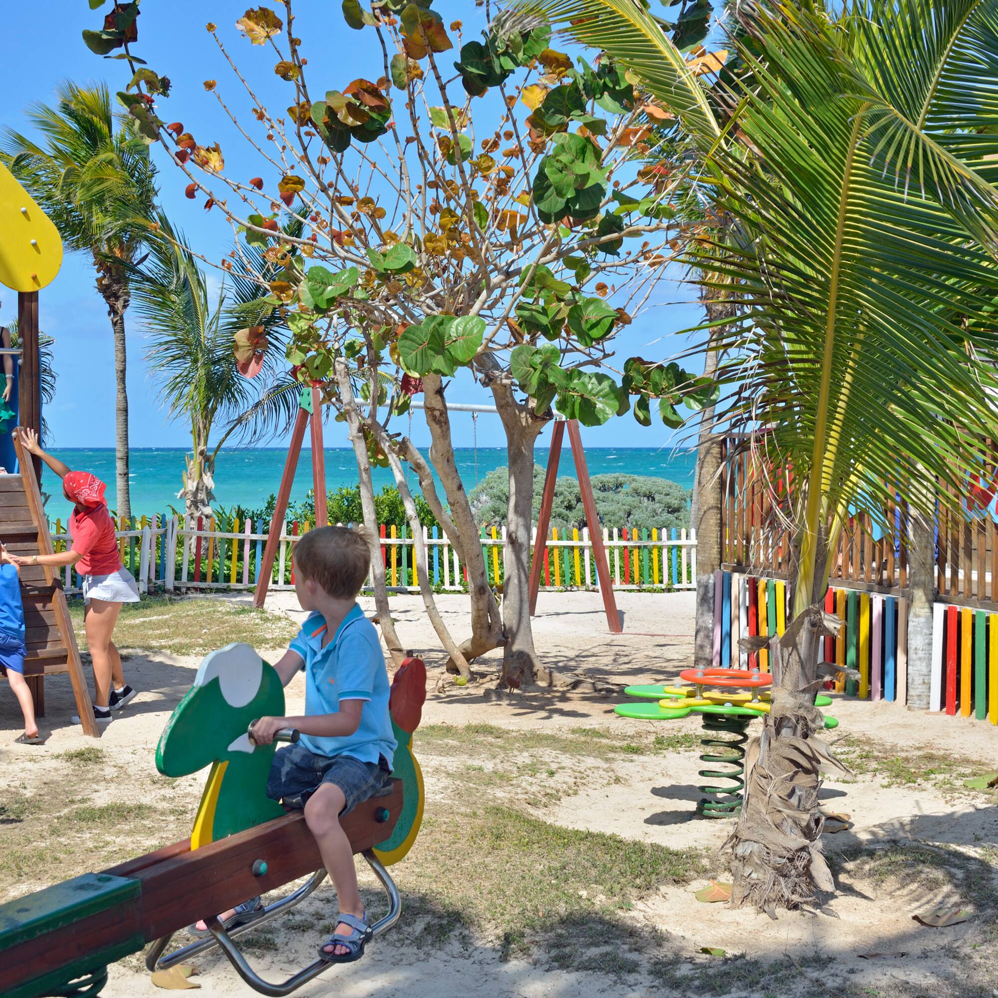 a child on a seesaw in a park